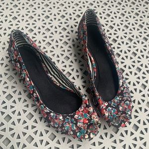 Floral open-toe wedges.